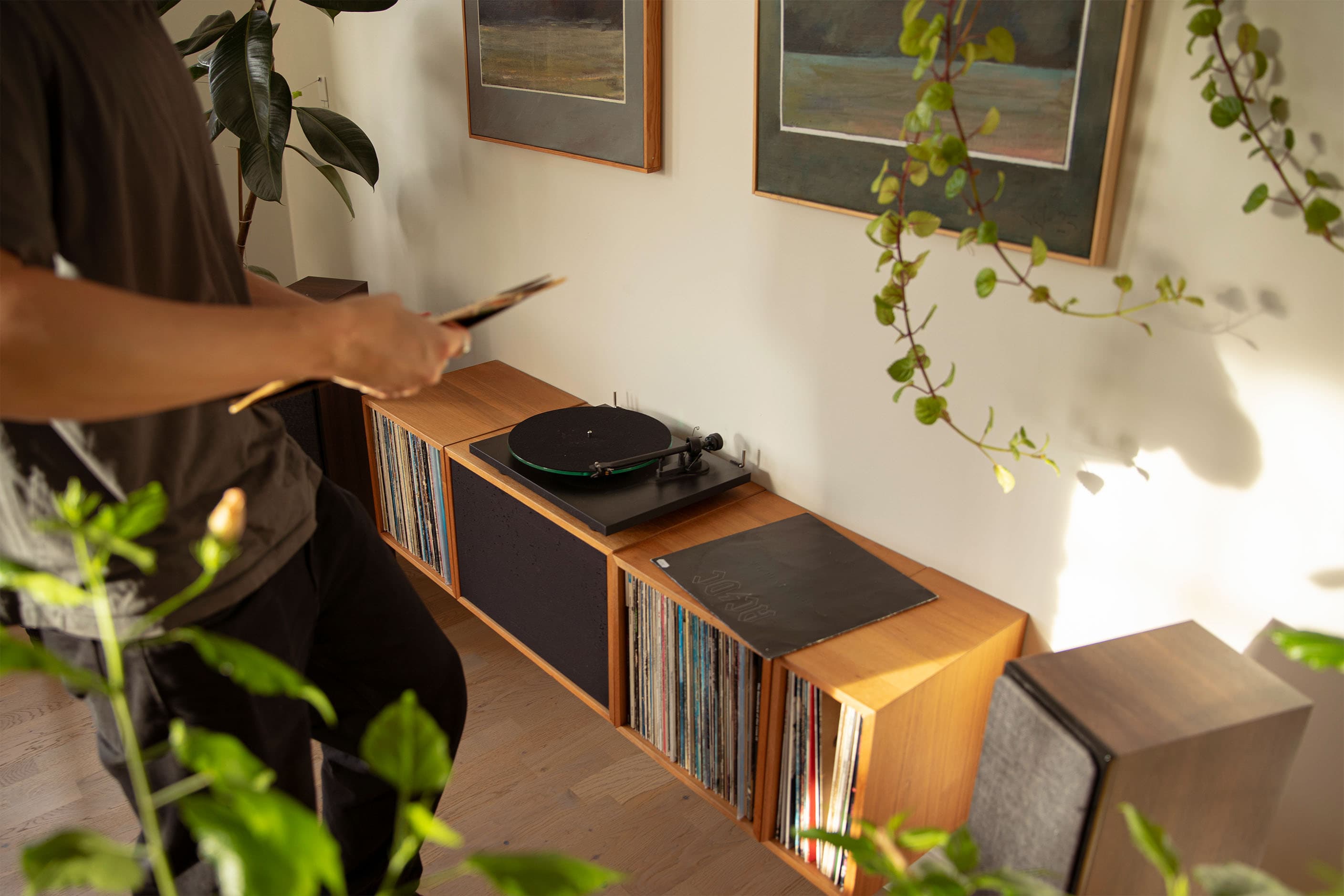 man sitting with laptop in light living room